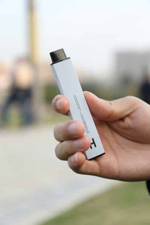 hand holding electronic cigarette